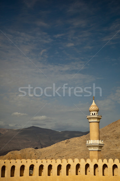 Stunning view of the Nizwa fort surrounded by mountains Stock photo © lightpoet