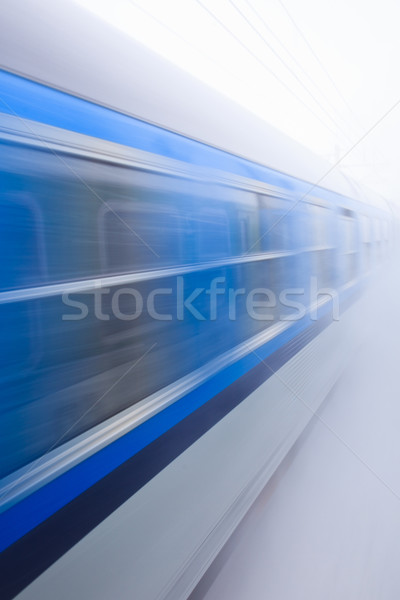 Train going fast in a snow storm Stock photo © lightpoet