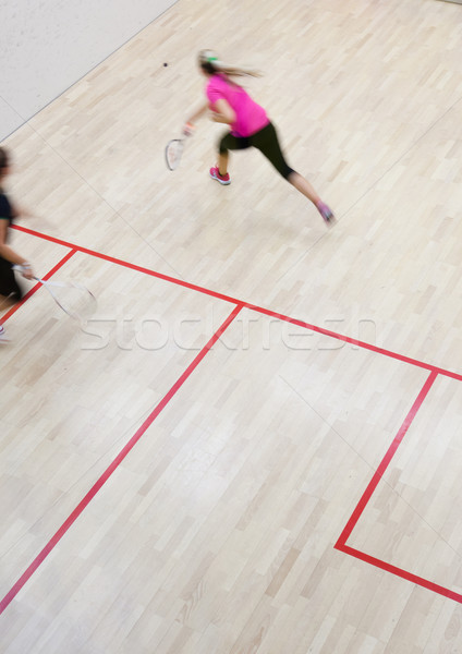 Two female squash players in fast action on a squash court  Stock photo © lightpoet