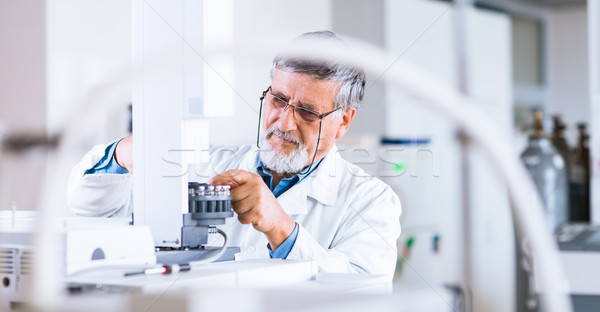 Stock photo: senior male researcher carrying out scientific research in a lab
