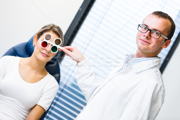 Optometry concept - pretty young woman having her eyes examined  Stock photo © lightpoet