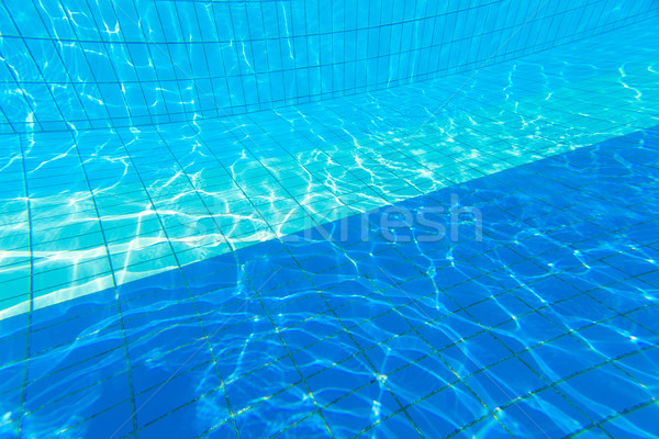 Blue water in a swimming pool Stock photo © lightpoet