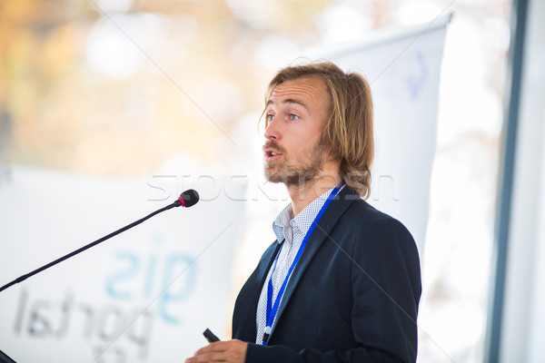 Handsome young man giving a speech at a conference Stock photo © lightpoet