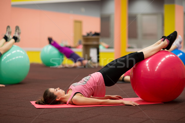Csoportkép pilates osztály tornaterem fiatal nő fitnessz Stock fotó © lightpoet