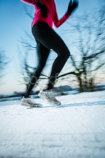 Young woman running outdoors on a cold winter day Stock photo © lightpoet
