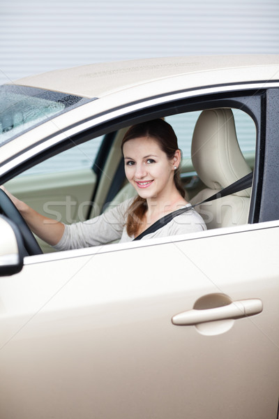 Pretty young woman driving her new car  Stock photo © lightpoet