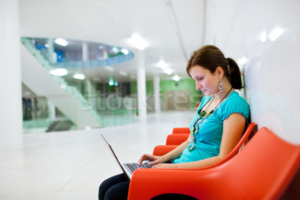 Pretty young female student with laptop on university campus Stock photo © lightpoet