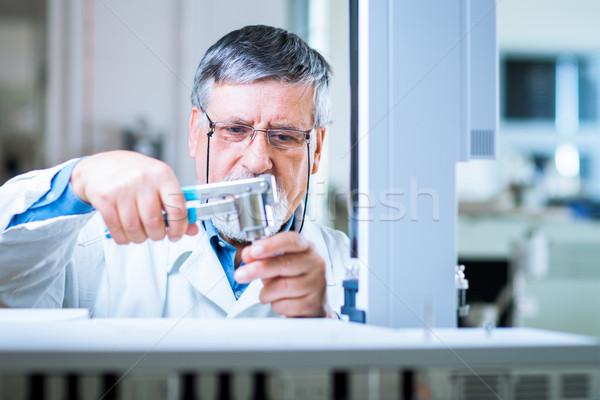 senior male researcher carrying out scientific research in a lab Stock photo © lightpoet