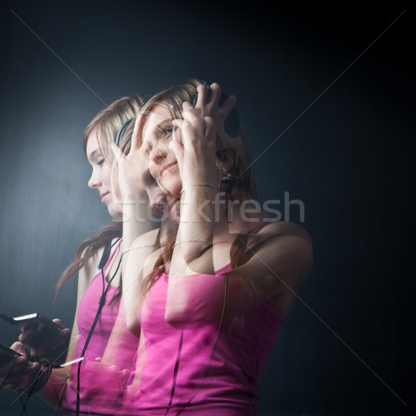 Music please! - Portrait of a  young woman/teenager listen to music Stock photo © lightpoet