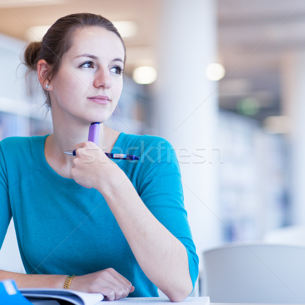 female college student in a library Stock photo © lightpoet
