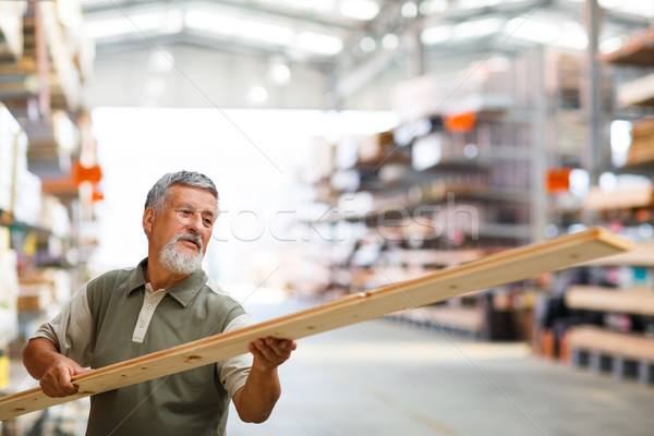 Stock photo: Man buying construction wood in a  DIY store 