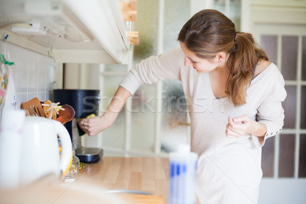 Fiatal nő házimunka takarítás konyha ház lány Stock fotó © lightpoet