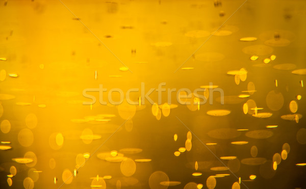 Golden macro background: gas bubbles in beer Stock photo © lightpoet