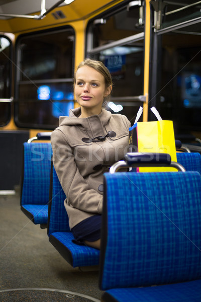 Pretty, young woman on a streetcar/tramway Stock photo © lightpoet