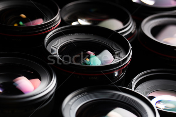 Modern camera lenses with reflections, low key image Stock photo © lightpoet