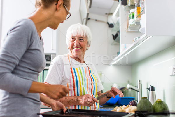 Senior woman/grandmother cooking in a modern kitchen  Stock photo © lightpoet
