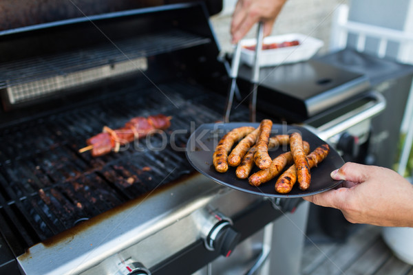 Zdjęcia stock: BBQ · kiełbasy · czerwony · mięsa · grill · mężczyzna