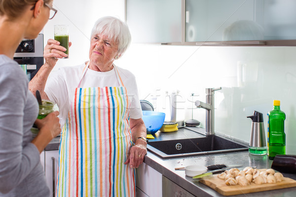Senior woman/grandmother cooking in a modern kitchen  Stock photo © lightpoet