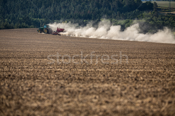 Stock photo: Tractor plowing a dry farm field