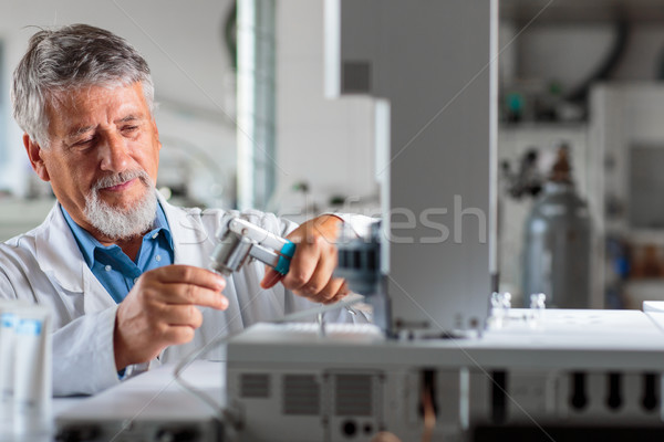 Stock photo: Senior chemistry professor/doctor in a lab