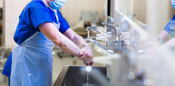 Surgeon in hospital washing thorouughly his hands Stock photo © lightpoet