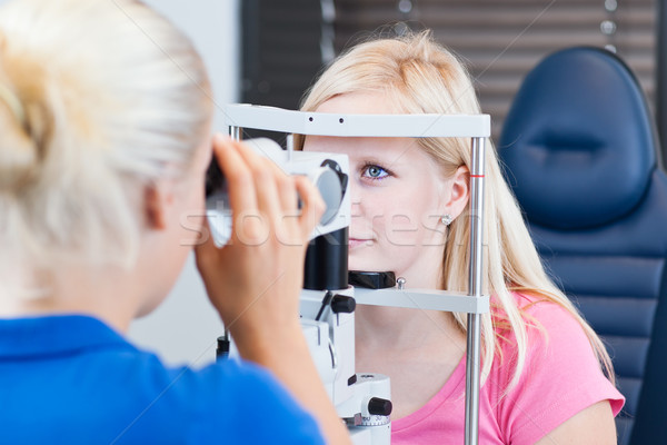 young female patient having her eyes examined  Stock photo © lightpoet