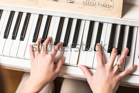 Playing Piano (shallow DOF; color toned image) Stock photo © lightpoet