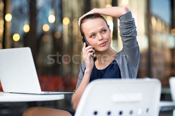 Portrait of a sleek young woman calling on a smartphone Stock photo © lightpoet