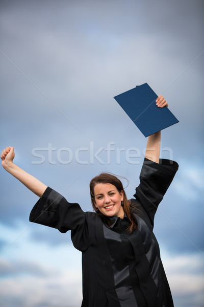 Pretty, young woman celebrating joyfully her graduation  Stock photo © lightpoet