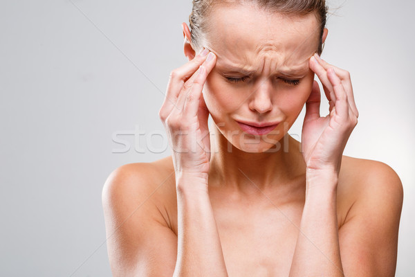 Beautiful woman suffering from acute headache Stock photo © lightpoet