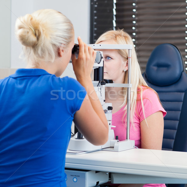Stock photo: young female patient having her eyes examined 