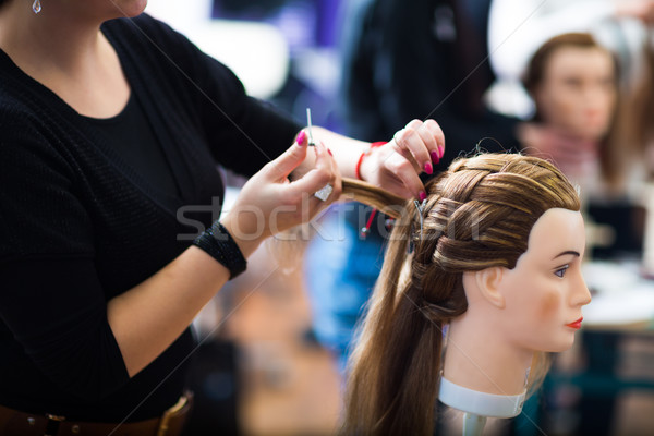 Pretty female hairdresser/haidressing apprentice/student trainin Stock photo © lightpoet