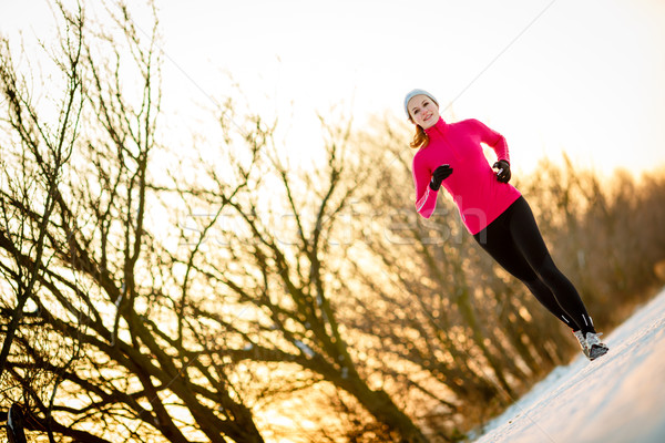 Young woman running outdoors on a cold winter day Stock photo © lightpoet