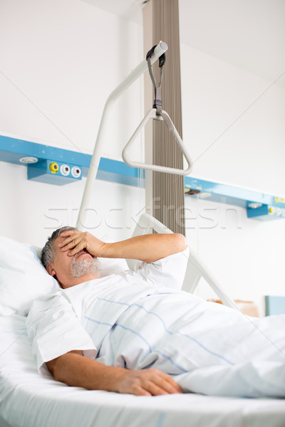 Patient in hospital room - suffering from pain after surgery Stock photo © lightpoet
