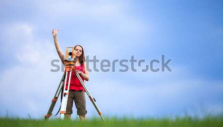 Stock photo: Young land surveyor at work