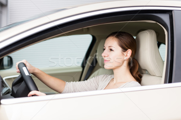 Pretty young woman driving her new car  Stock photo © lightpoet