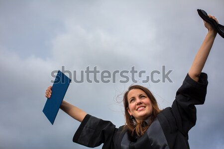 Pretty, young woman celebrating joyfully her graduation Stock photo © lightpoet