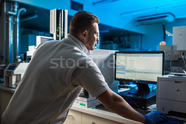 Portrait of a male researcher carrying out scientific research in lab Stock photo © lightpoet