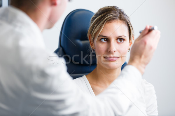 Optometry concept - pretty young woman having her eyes examined  Stock photo © lightpoet