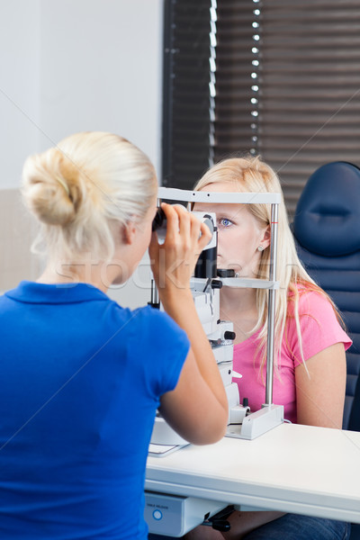 young female patient having her eyes examined  Stock photo © lightpoet