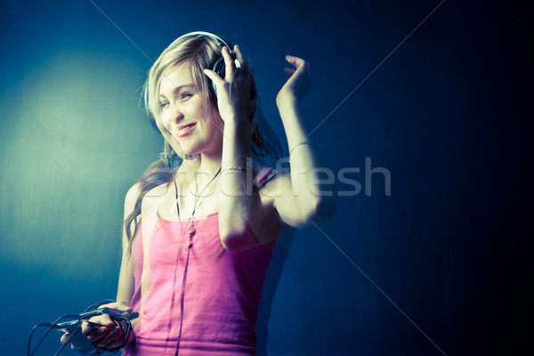 Music please! - Portrait of a pretty young woman/teenager Stock photo © lightpoet