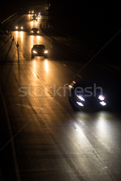 Busy highway at night with cars of commuters going home Stock photo © lightpoet
