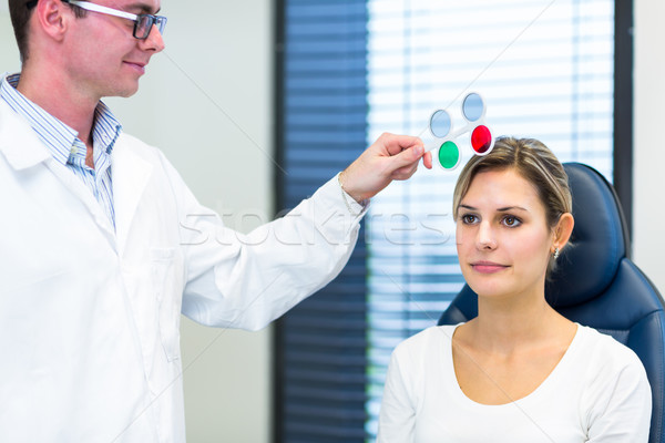 Optometry concept - pretty young woman having her eyes examined  Stock photo © lightpoet