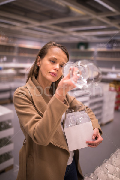 Pretty, young woman in a home supply store  Stock photo © lightpoet