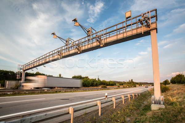 Truck passing through a toll gate on a highway (motion blurred i Stock photo © lightpoet