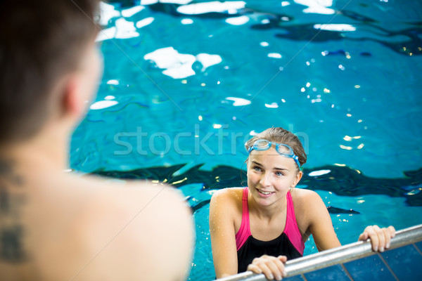Female swimmer in an indoor swimming pool - doing crawl Stock photo © lightpoet