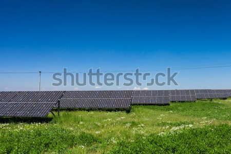 Sunlight as a resource of renewable energy: solar panels Stock photo © lightpoet