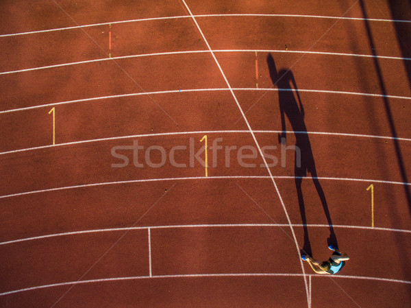 Shot of a young male athlete training on a race track  Stock photo © lightpoet