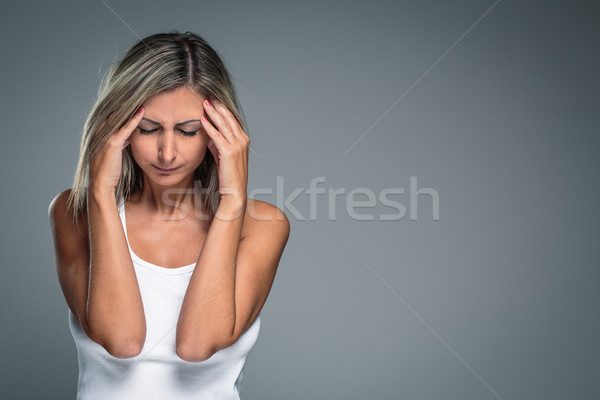 Gorgeous young woman with severe headache/migraine/depression  Stock photo © lightpoet