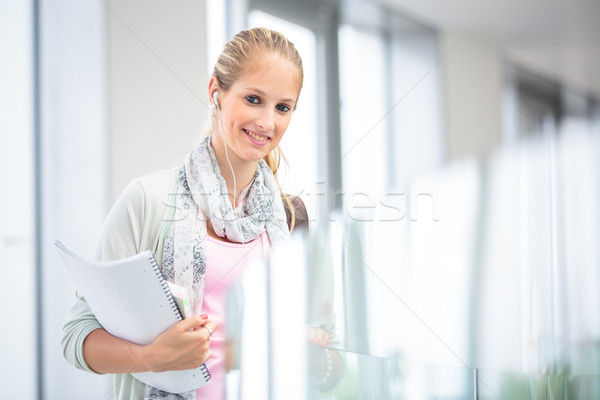 Student on campus - pretty, female student with books and laptop Stock photo © lightpoet